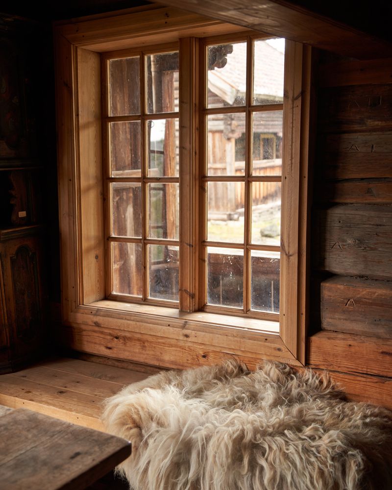 Sheepskin rug in a warm rustic cabin interior