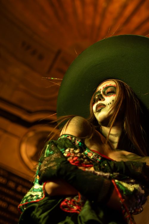 Free Woman in traditional Day of the Dead Catrina costume with dramatic face paint and intricate hat. Stock Photo