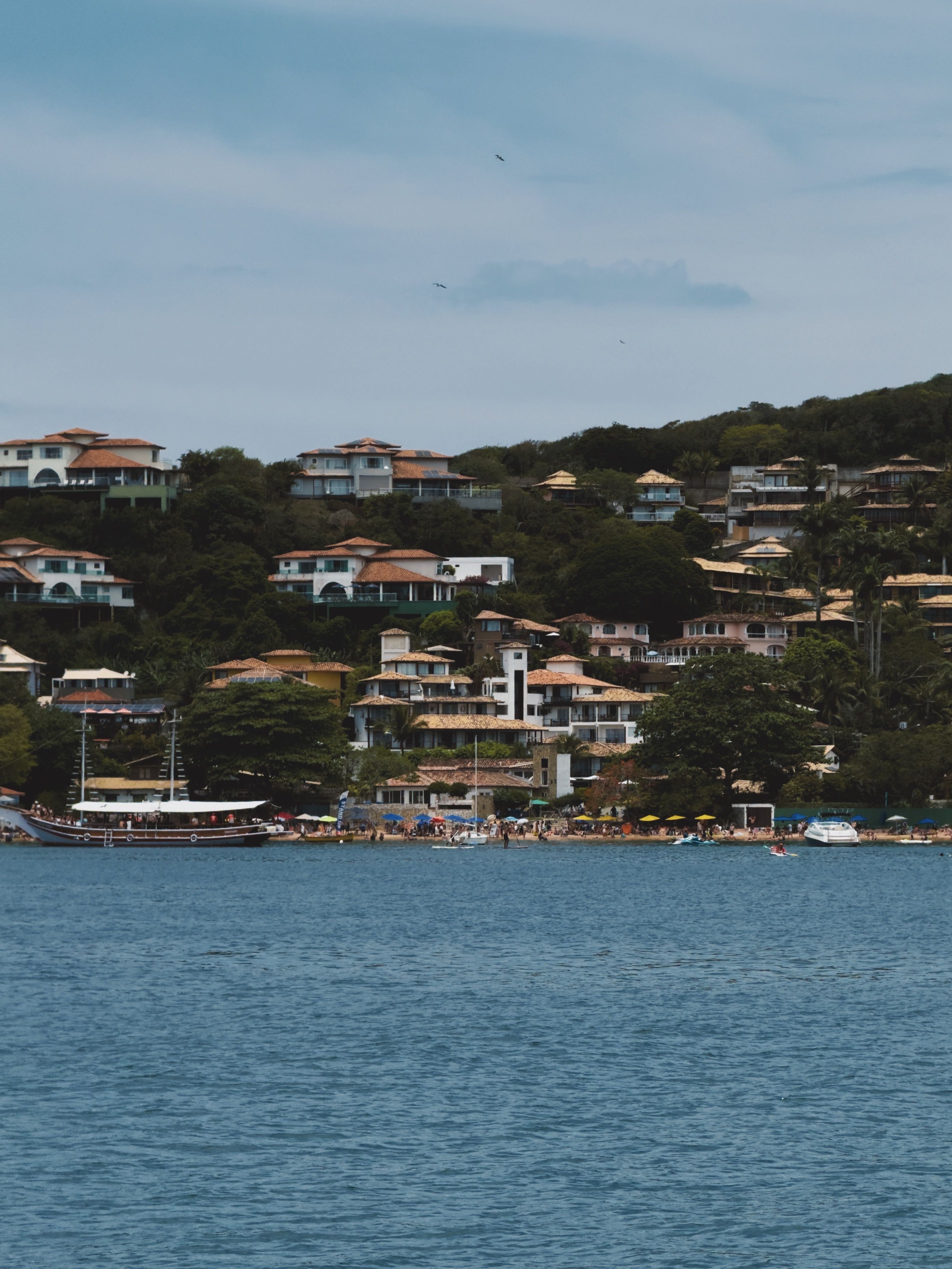 Scenic Coastal Town with Hillside Houses · Free Stock Photo