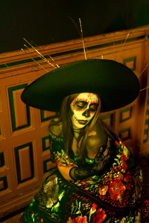 Free Woman in traditional Day of the Dead makeup and attire, vibrant colors. Stock Photo