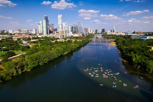Free Aerial shot of Austin, Texas skyline with kayaks on the Colorado River on a sunny day. Stock Photo