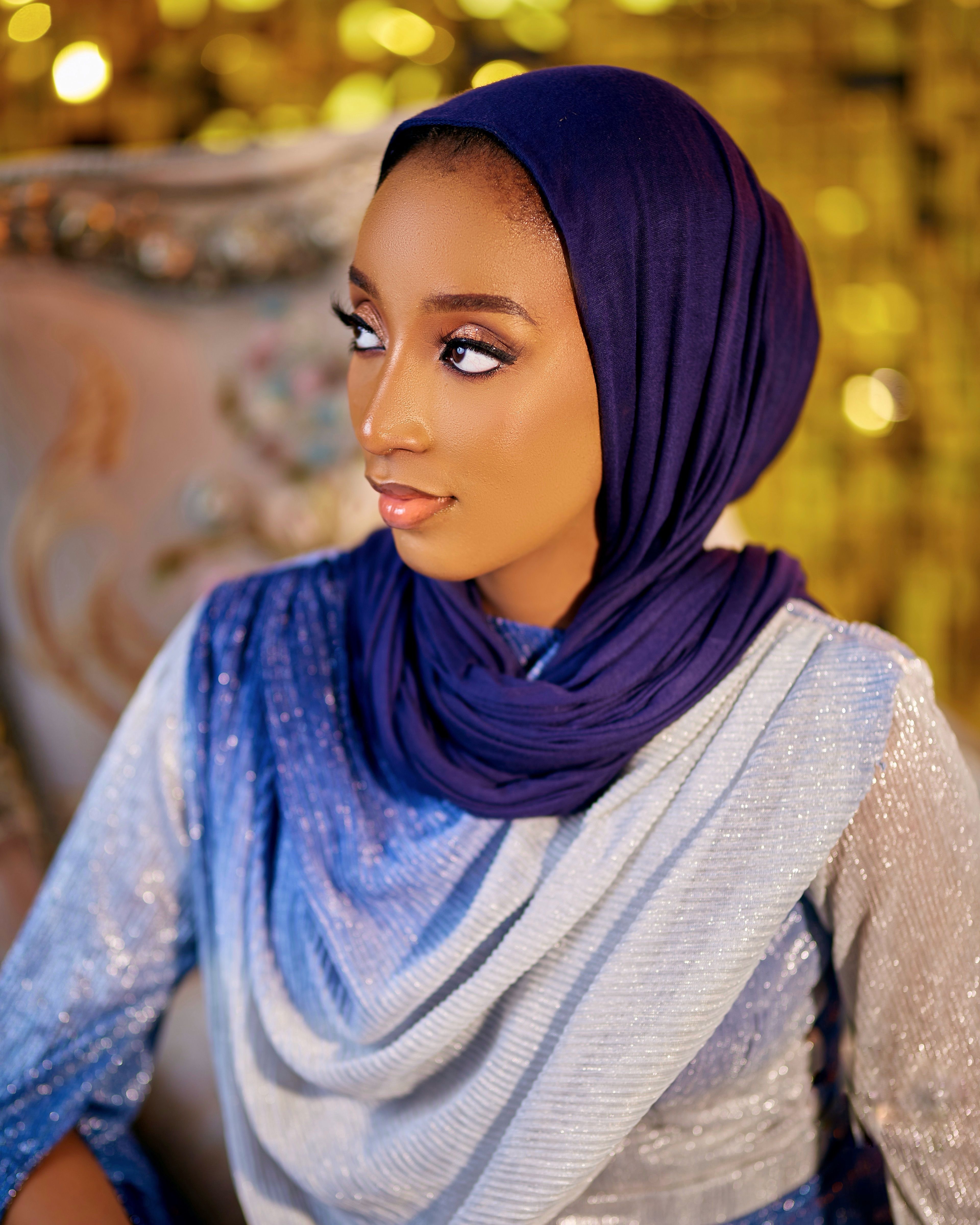 Elegant Portrait of Woman in Blue Hijab Looking Aside · Free Stock Photo