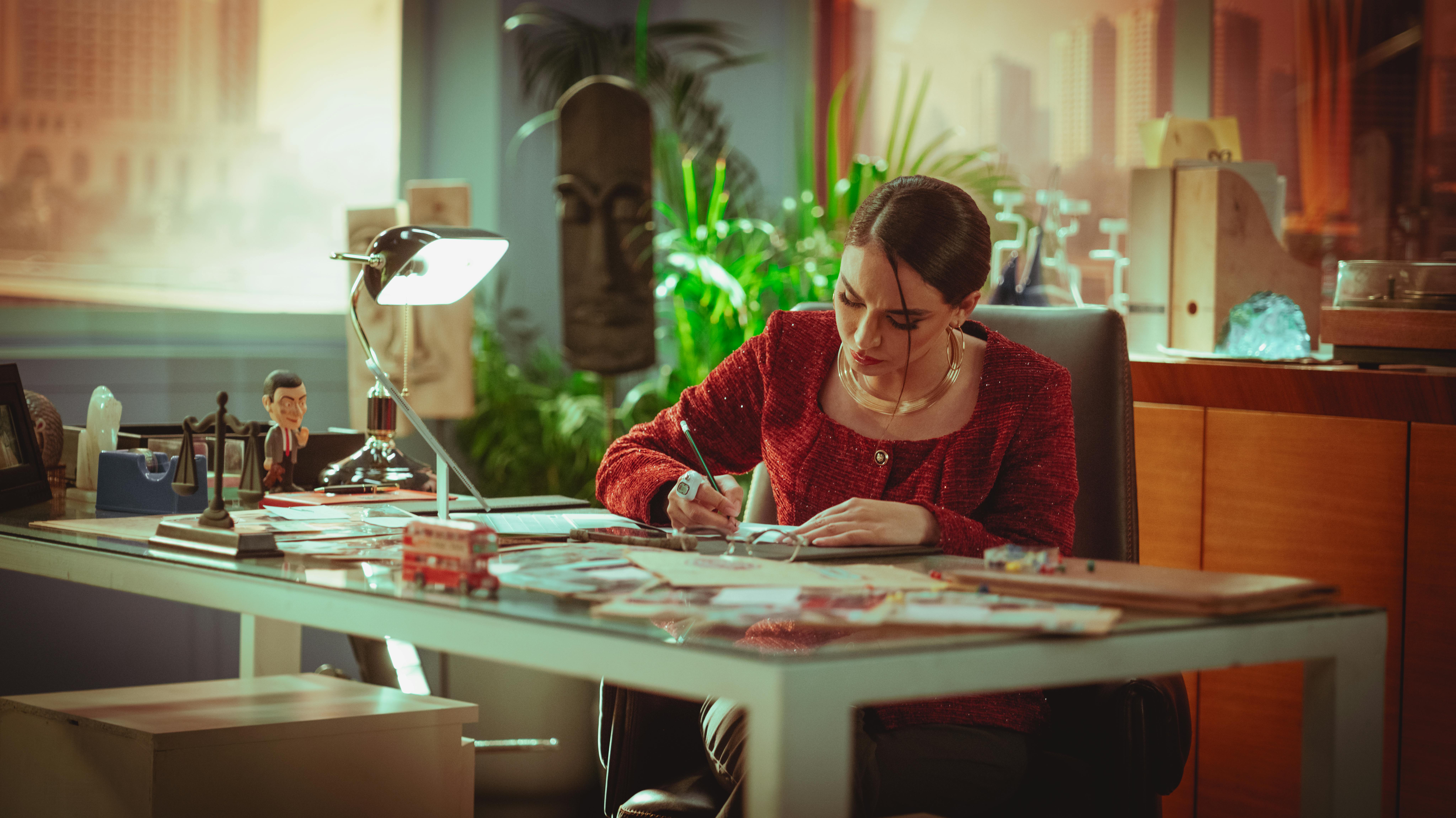 A Person Crossing Out Completed Tasks On A Planner