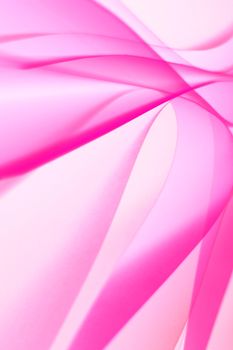 Delicate pink abstract waves create a soft, flowing design in this high-resolution image.