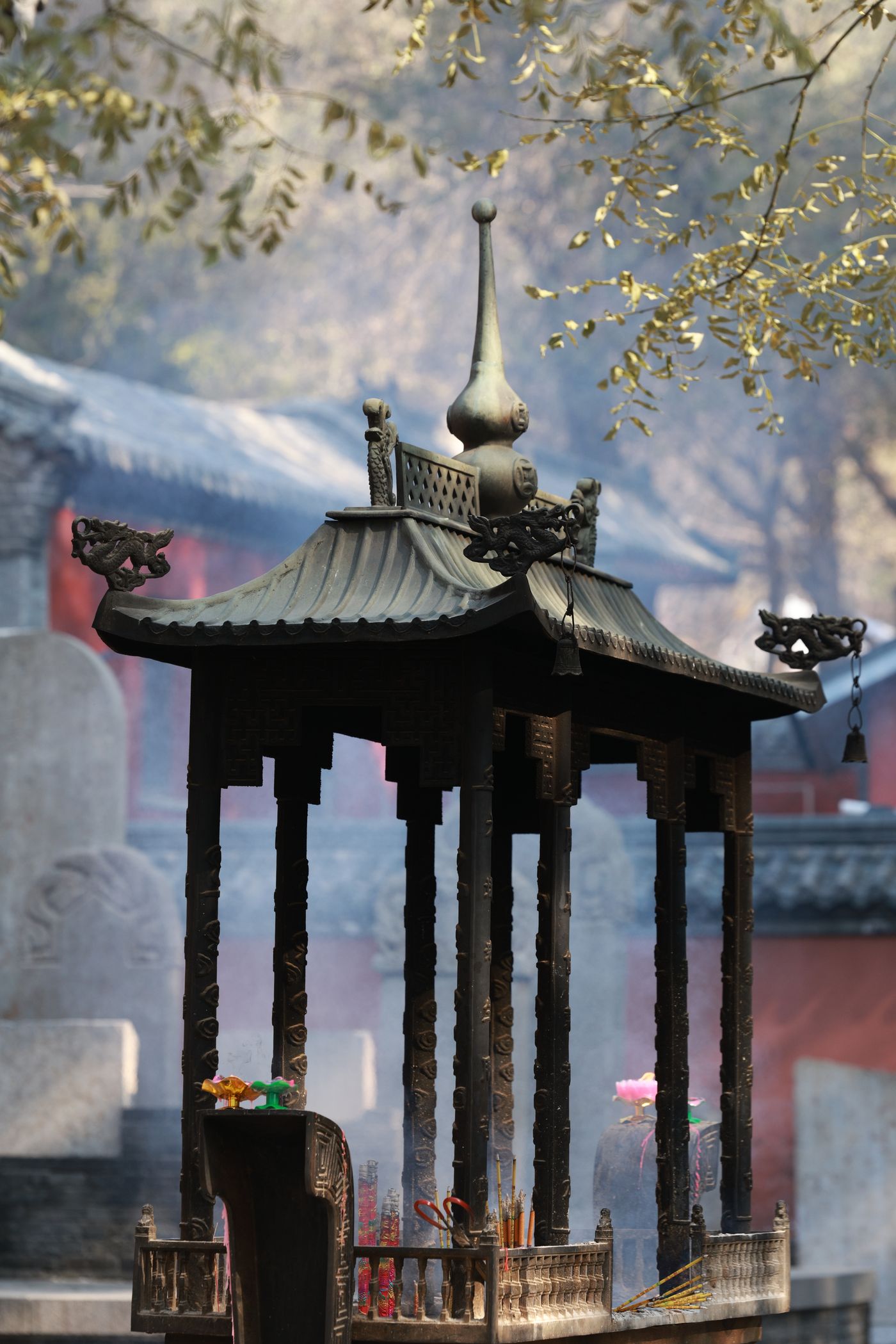 An incense burner at a temple, smoke rising