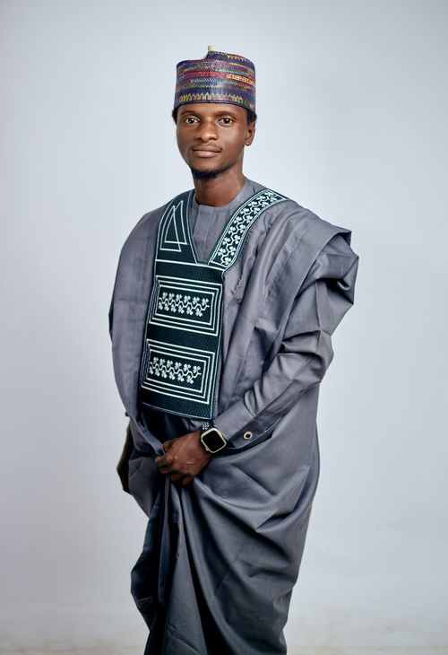 Free Young man wearing traditional African attire, posing confidently indoors. Stock Photo