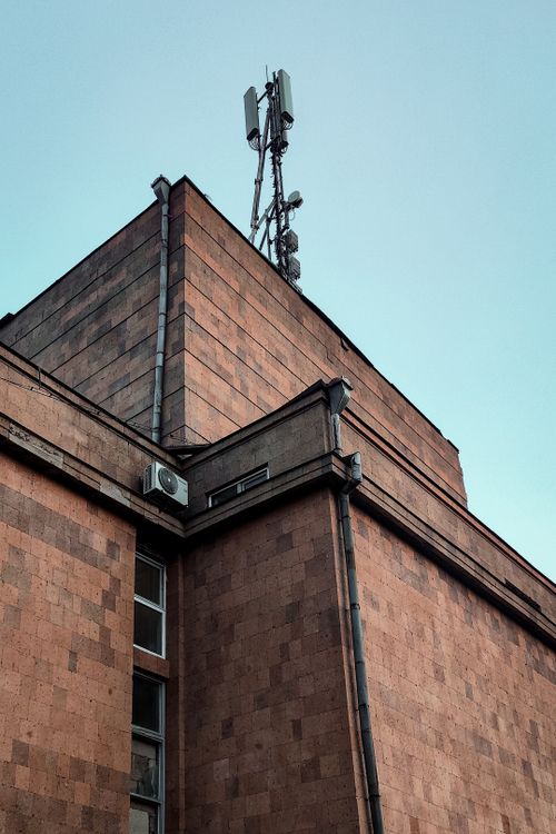 Free A street view of an architectural structure with antenna in Yerevan, Armenia, depicting urban infrastructure. Stock Photo