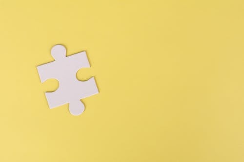 Jigsaw Puzzle on Yellow Background
