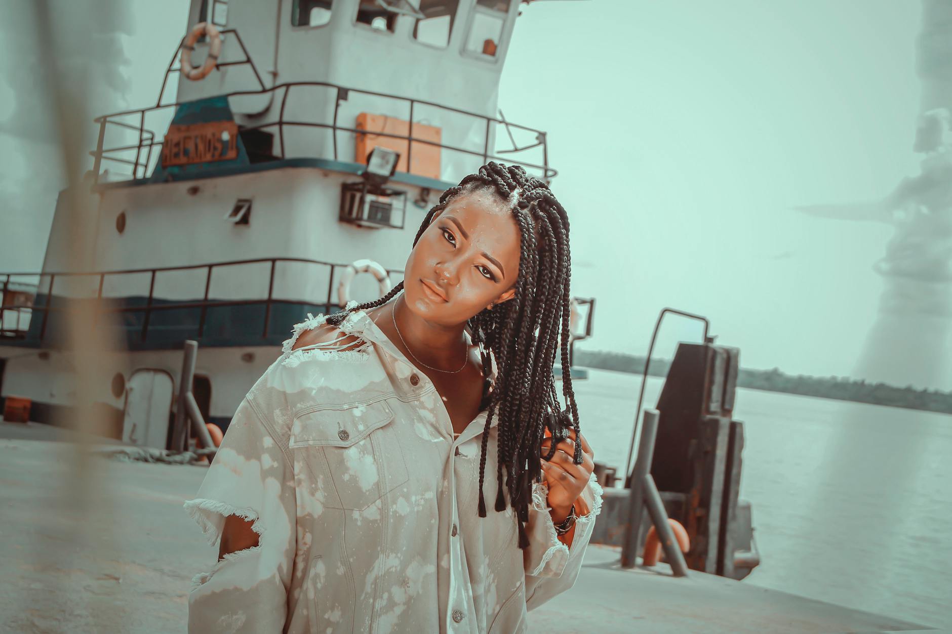 Woman in White Button Up Shirt Standing Near White Ship