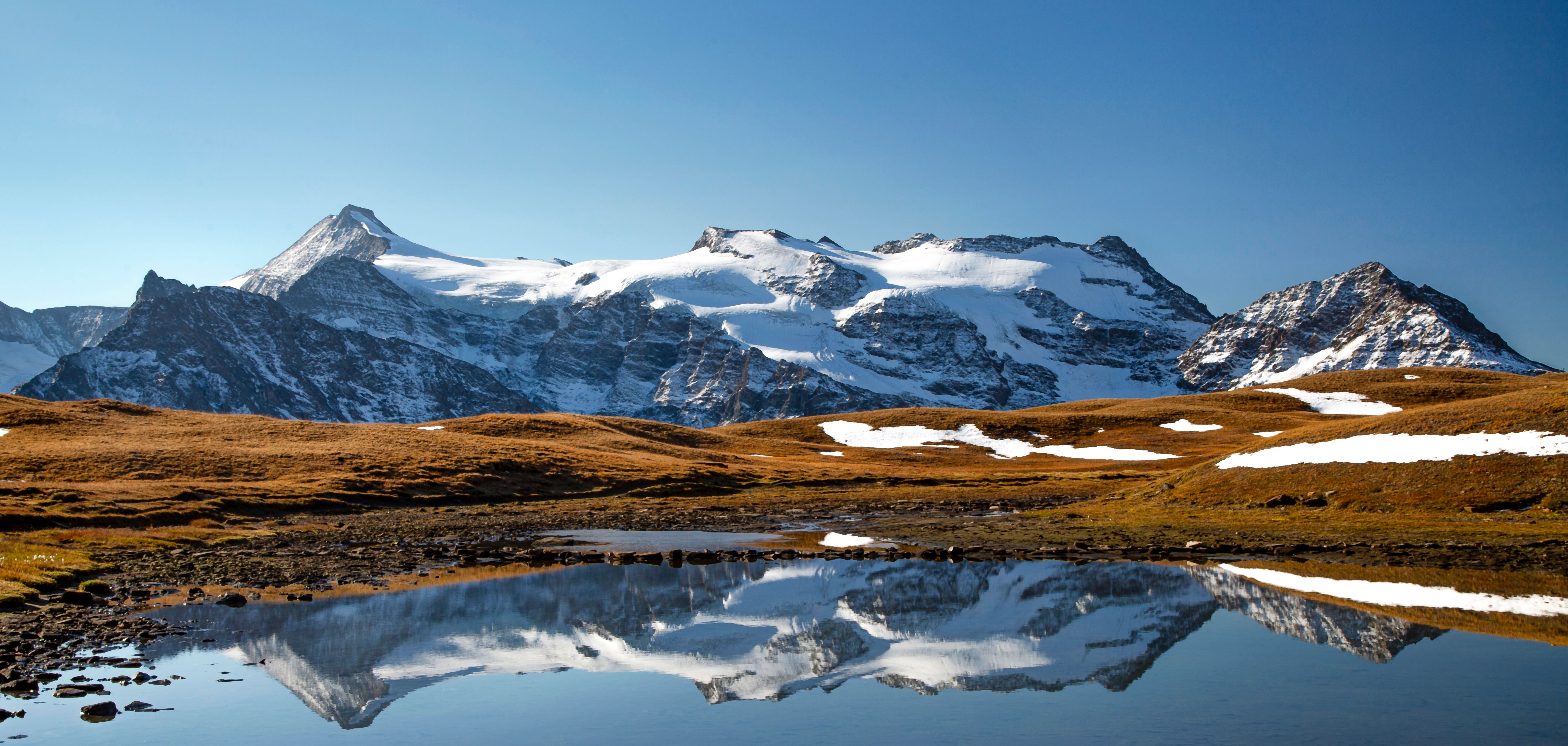 Scenic Mountain Landscape with Snow-Capped Peaks · Free Stock Photo