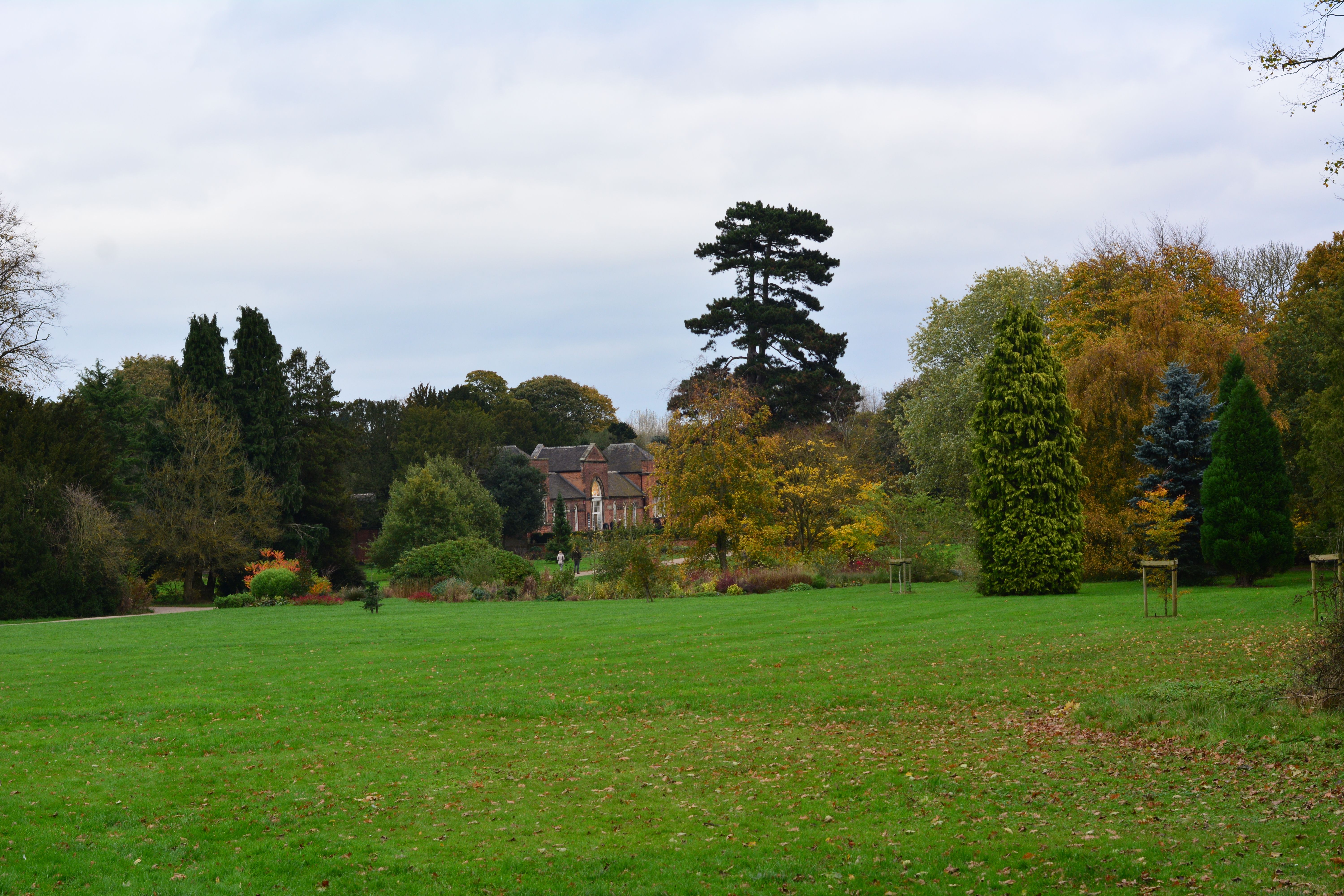 Beautiful autumn scenery with lush greenery and a historic building in Derby, UK.