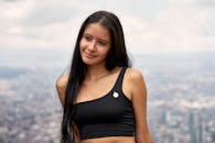 Portrait of a Woman Overlooking Bogotá Skyline