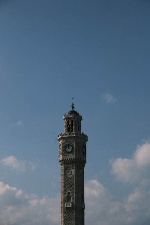 Free The historic Izmir Clock Tower set against a clear blue sky, showcasing its architectural elegance. Stock Photo