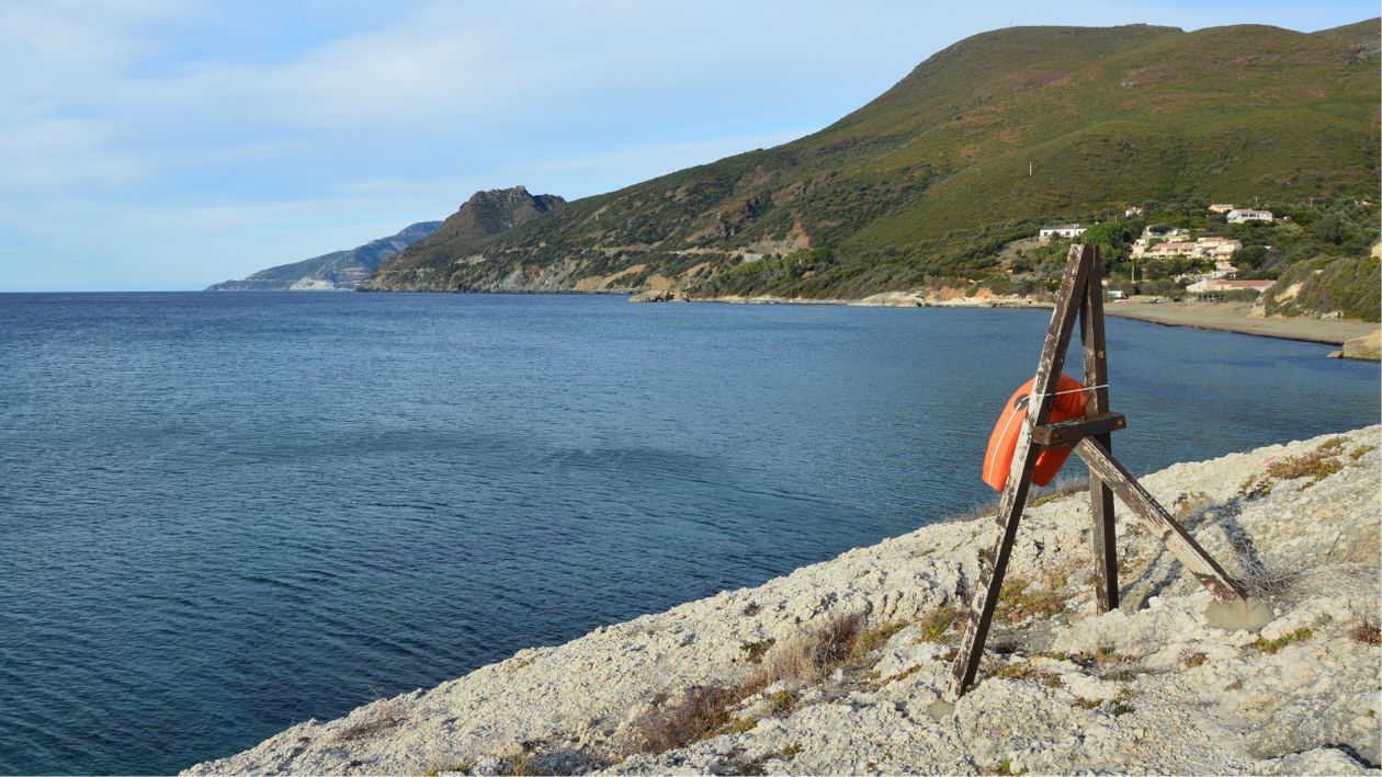 Free Breathtaking seascape of Farinole in Corsica, France, featuring rocky shores and the Mediterranean Sea. Stock Photo