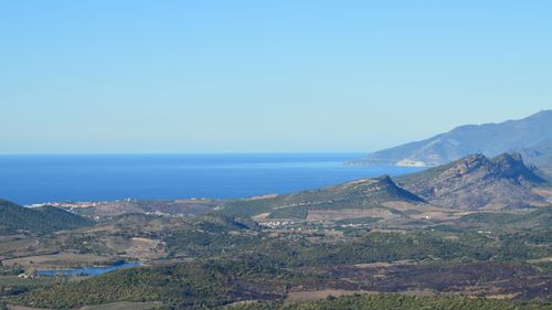 Free Aerial landscape view of Murato, Corsica, France showcasing coastal mountains and lush valleys. Stock Photo