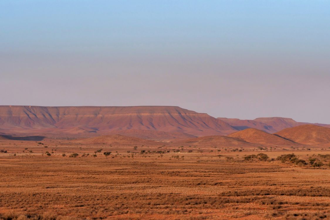 Distant Desert Vast Desert Landscape with Distant Mountains · Free Stock Photo