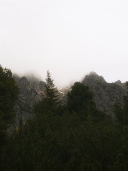 Captivating view of foggy, dramatic peaks in the High Tatras, Slovakia.