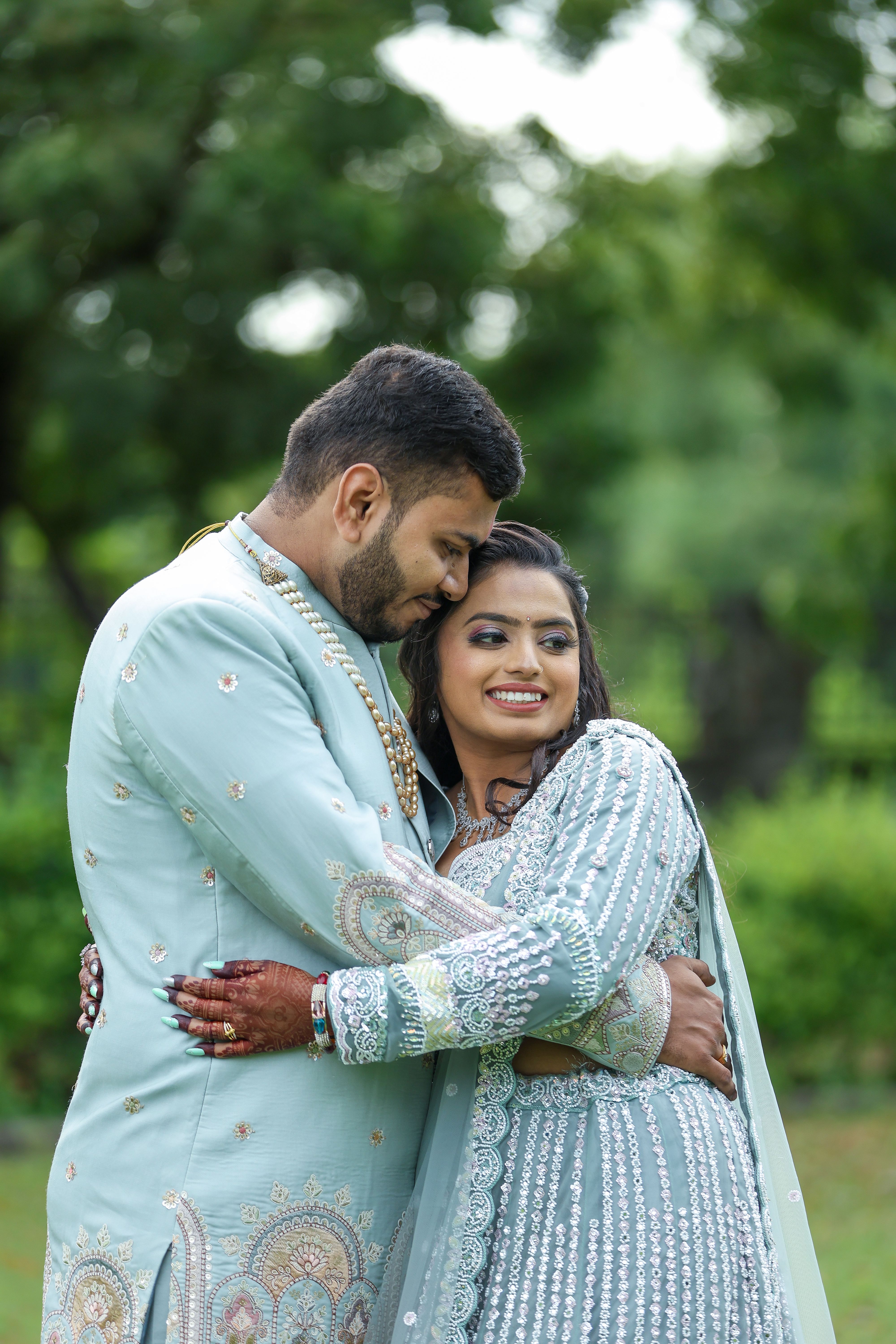 Romantic Couple Embracing Outdoors in Traditional Attire · Free Stock Photo