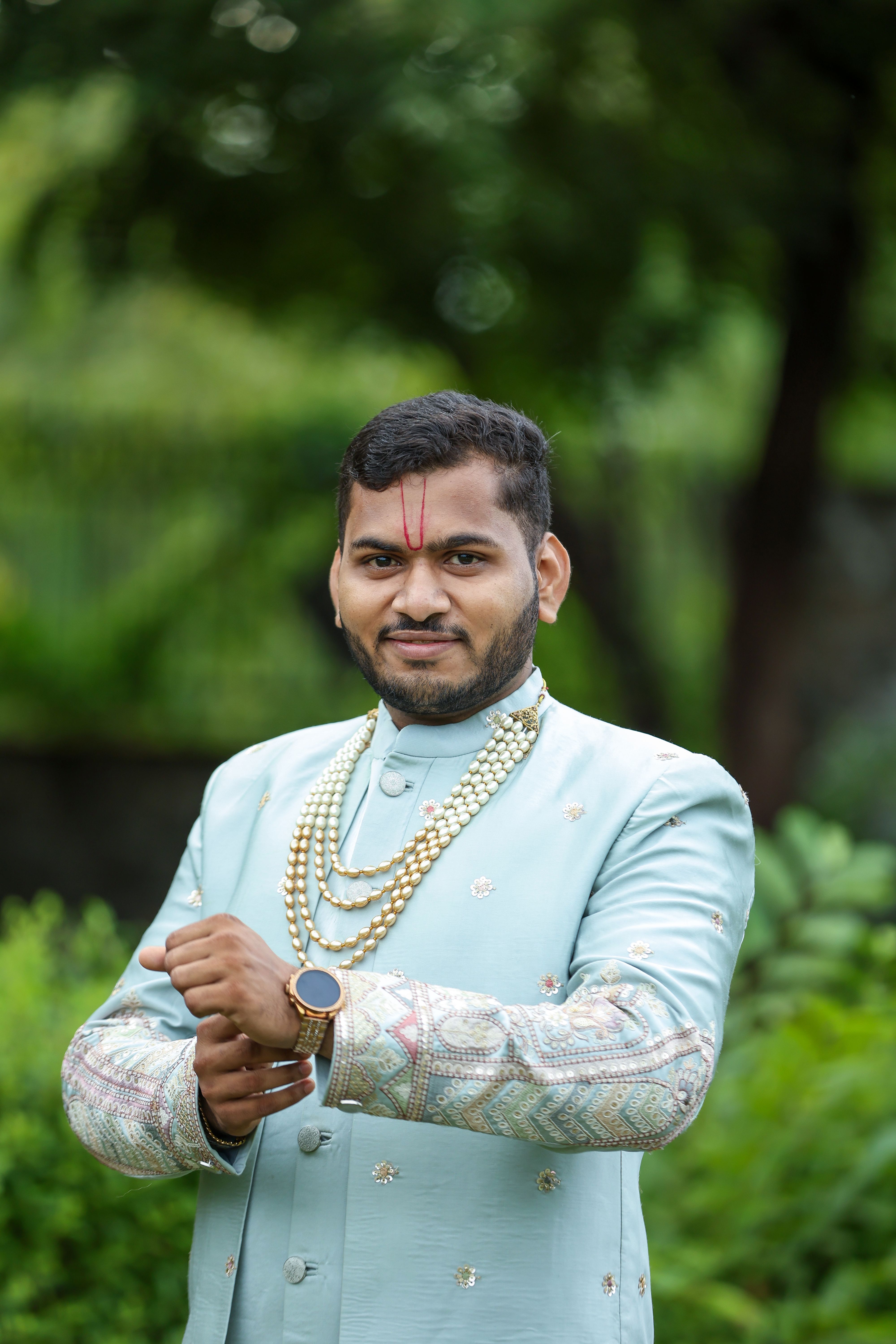 Elegant Portrait of Man in Traditional Attire Outdoors · Free Stock Photo