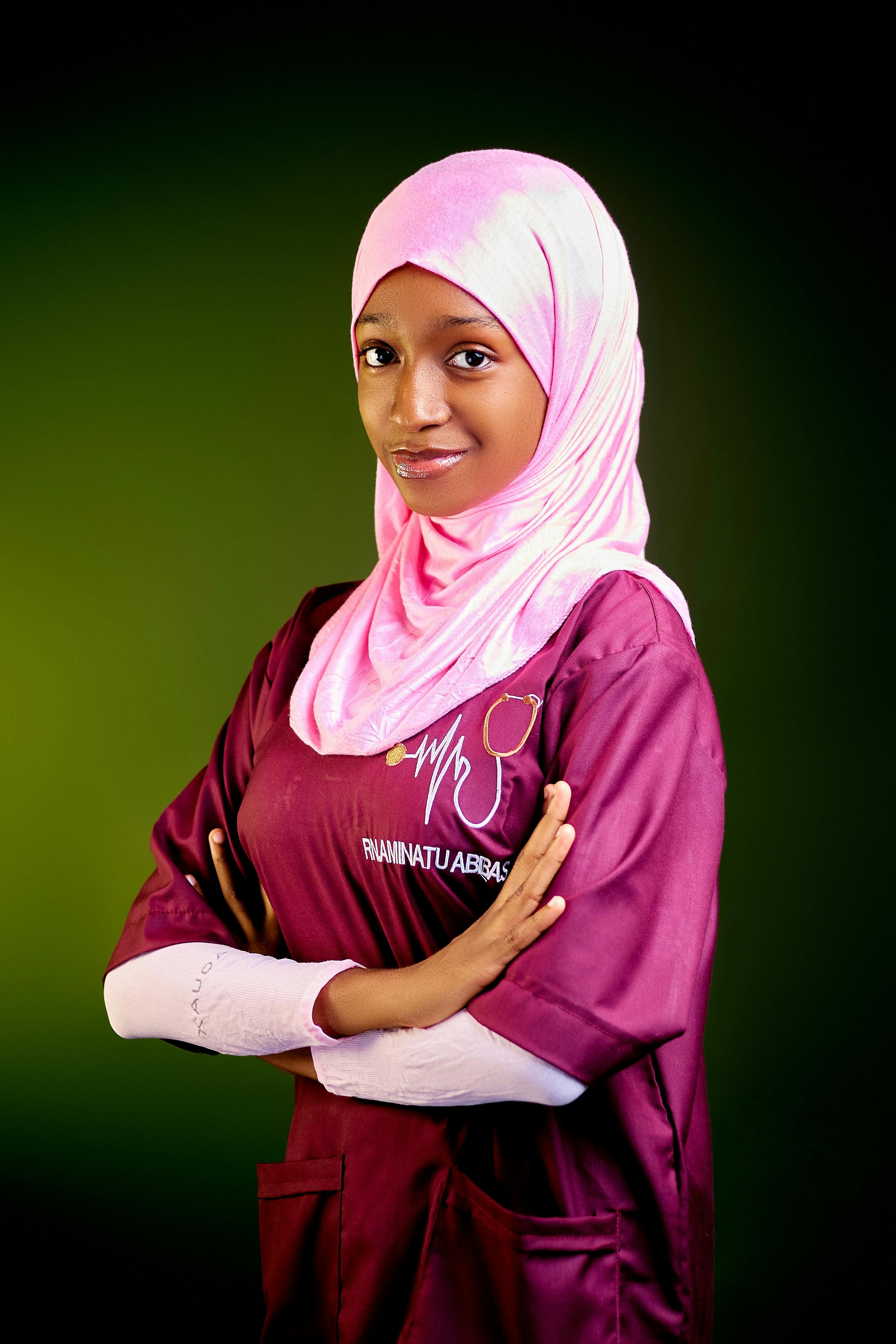 Young woman in medical attire displaying confidence and professionalism.