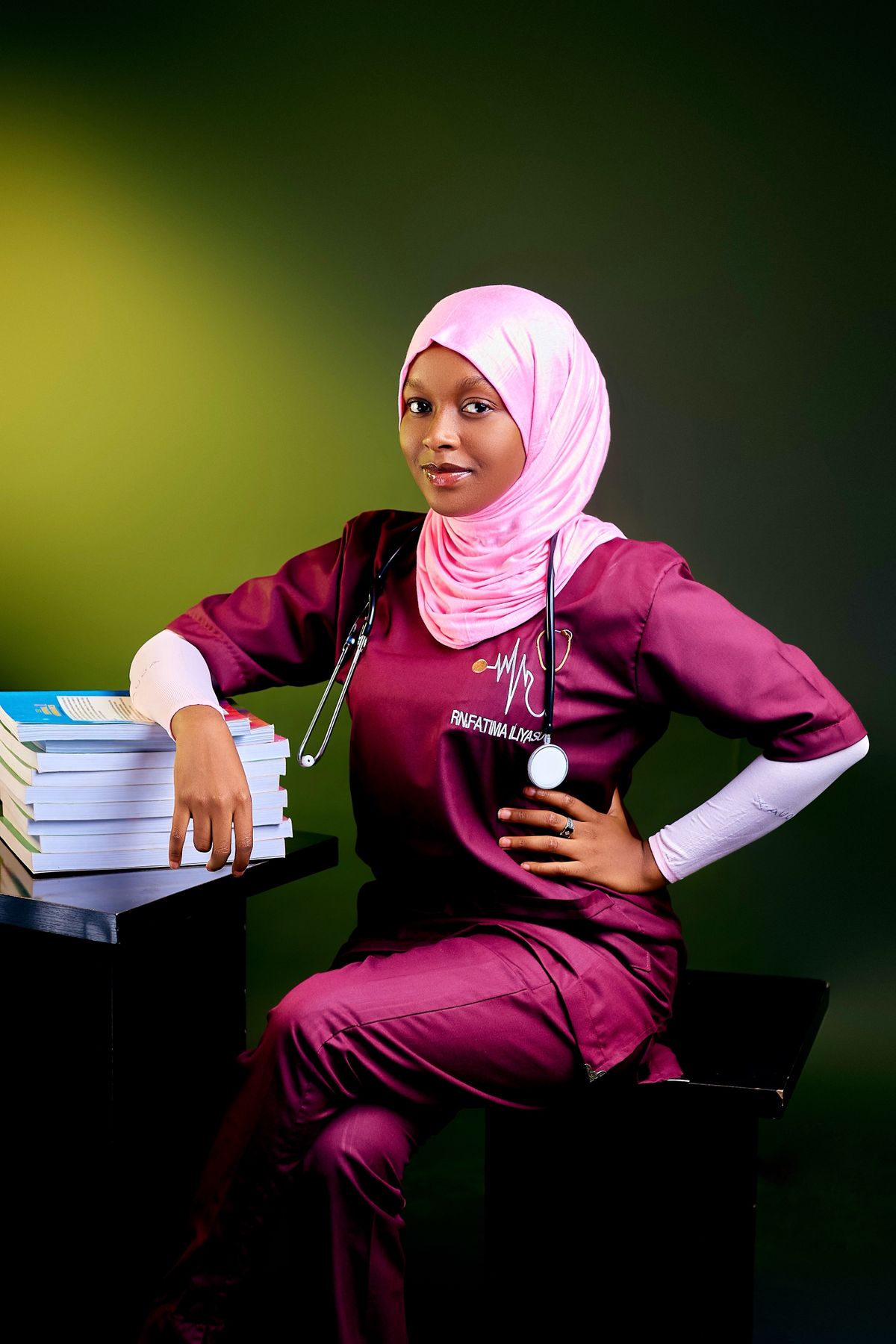 Nursing student sitting with books, preparing for a clinical rotation
