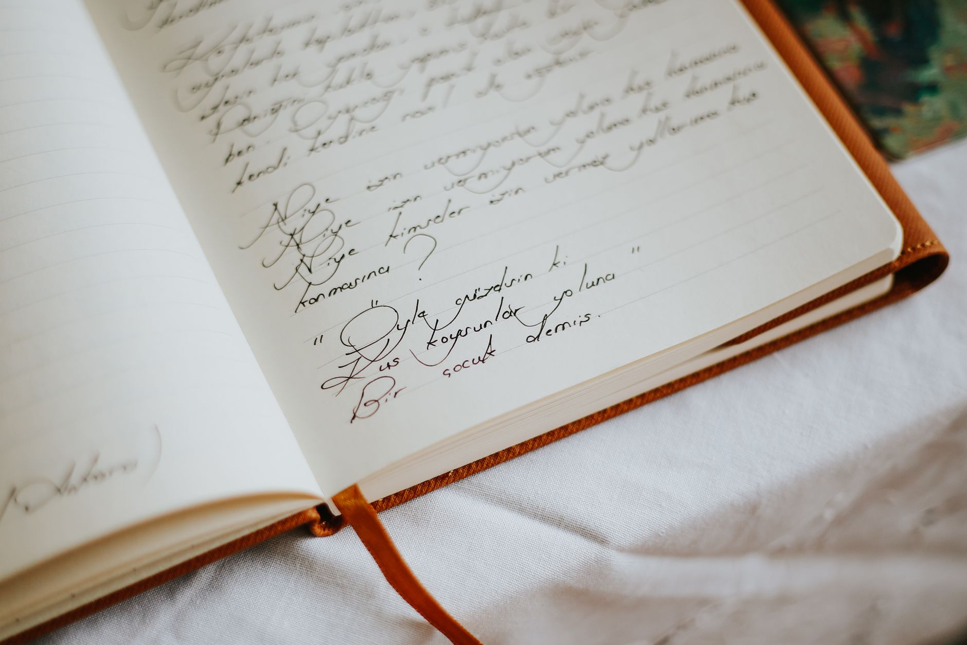 Mont Blanc leather notebook open on an executive desk with a fountain pen, showing handwritten notes