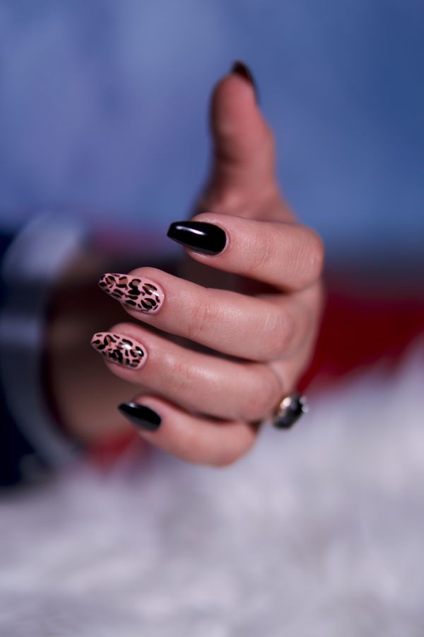 Glossy black polish on short nails