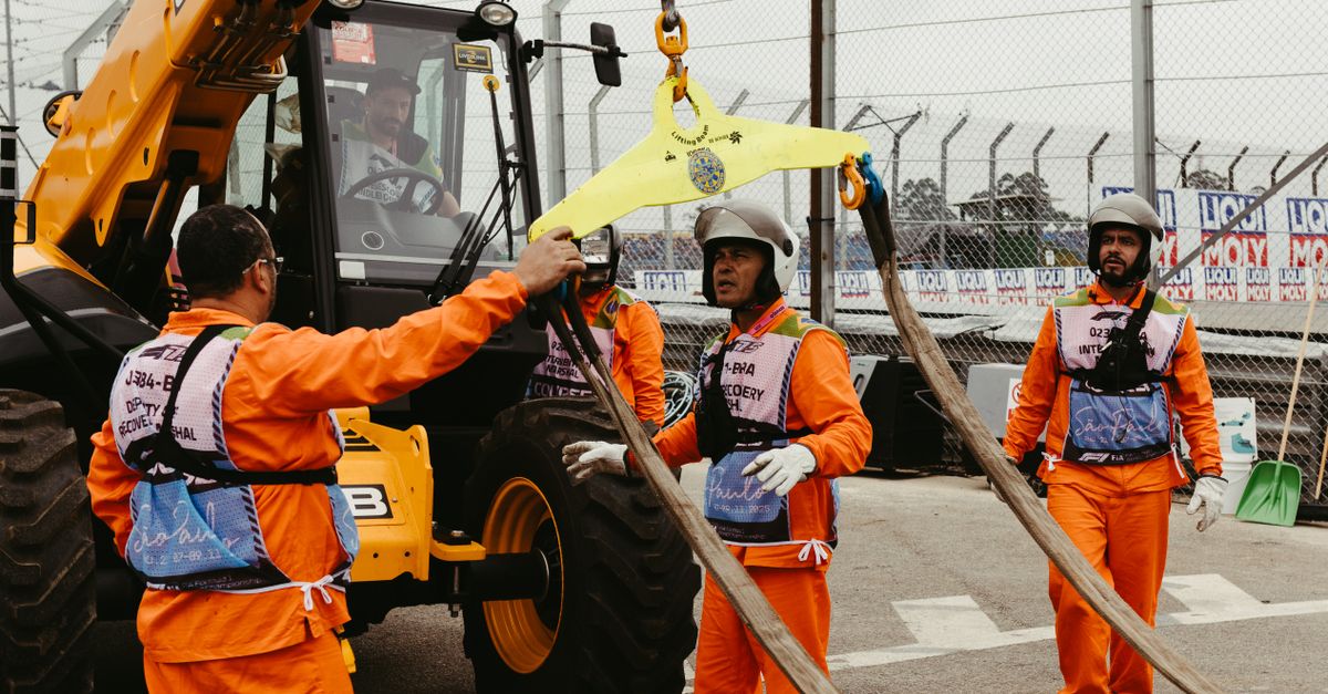 Track Racing Officials Track Officials Preparing Equipment at São Paulo Racing Event · Free ...