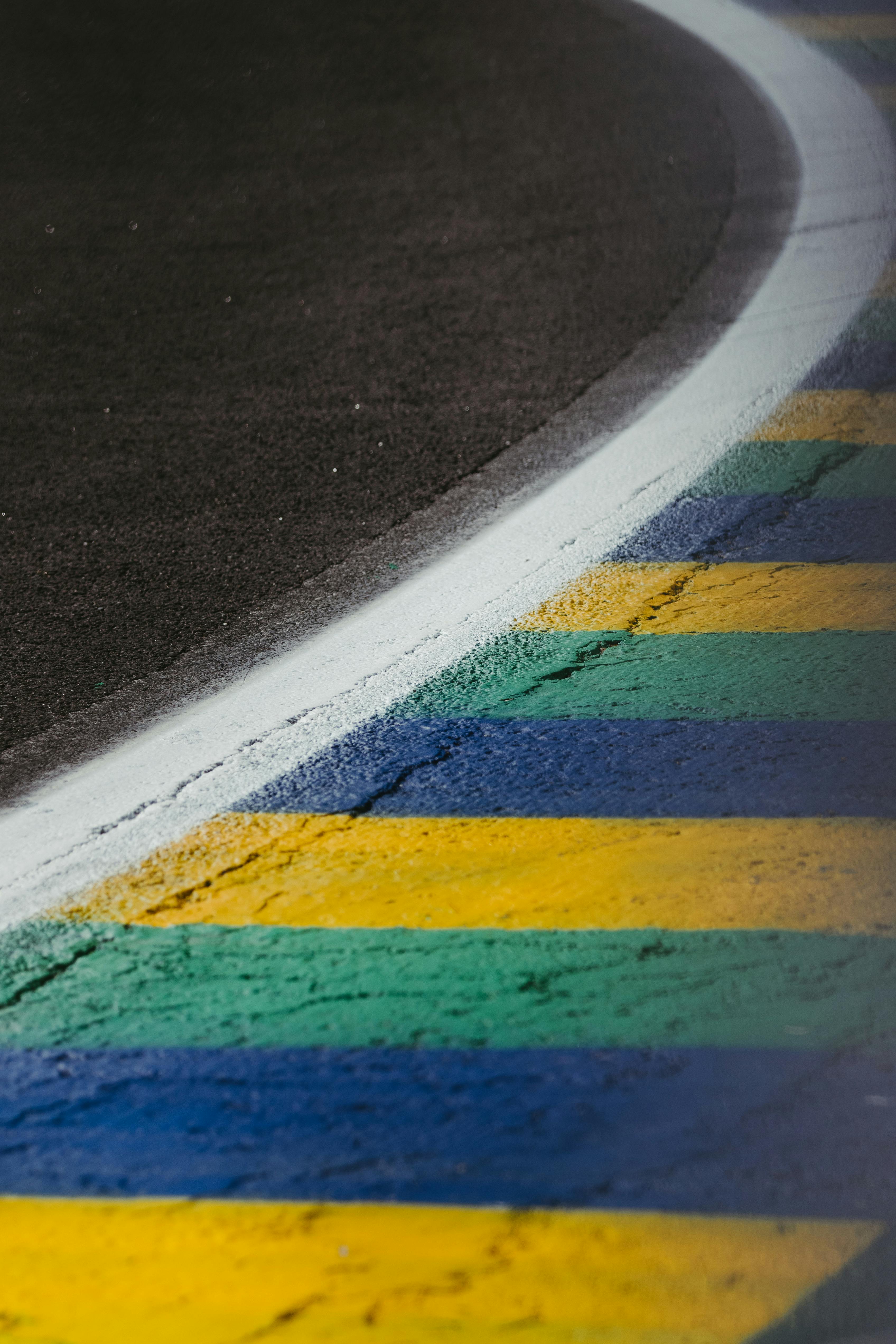 Free Colorful curved race track corner in São Paulo, Brazil, highlighting the vibrant stripes of motorsport. Stock Photo