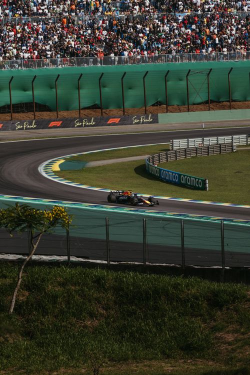Free A thrilling Formula 1 race car speeds through the iconic Interlagos Circuit in São Paulo, Brazil. Stock Photo