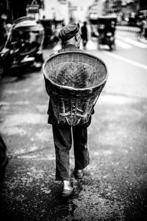 Man Carrying Basket