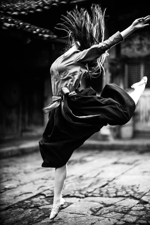 Free Woman in Black Skirt and White Long Sleeve Shirt Dancing Ballet Stock Photo