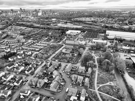 Stunning aerial shot of Manchester's urban sprawl, showcasing residential areas and city skyline.