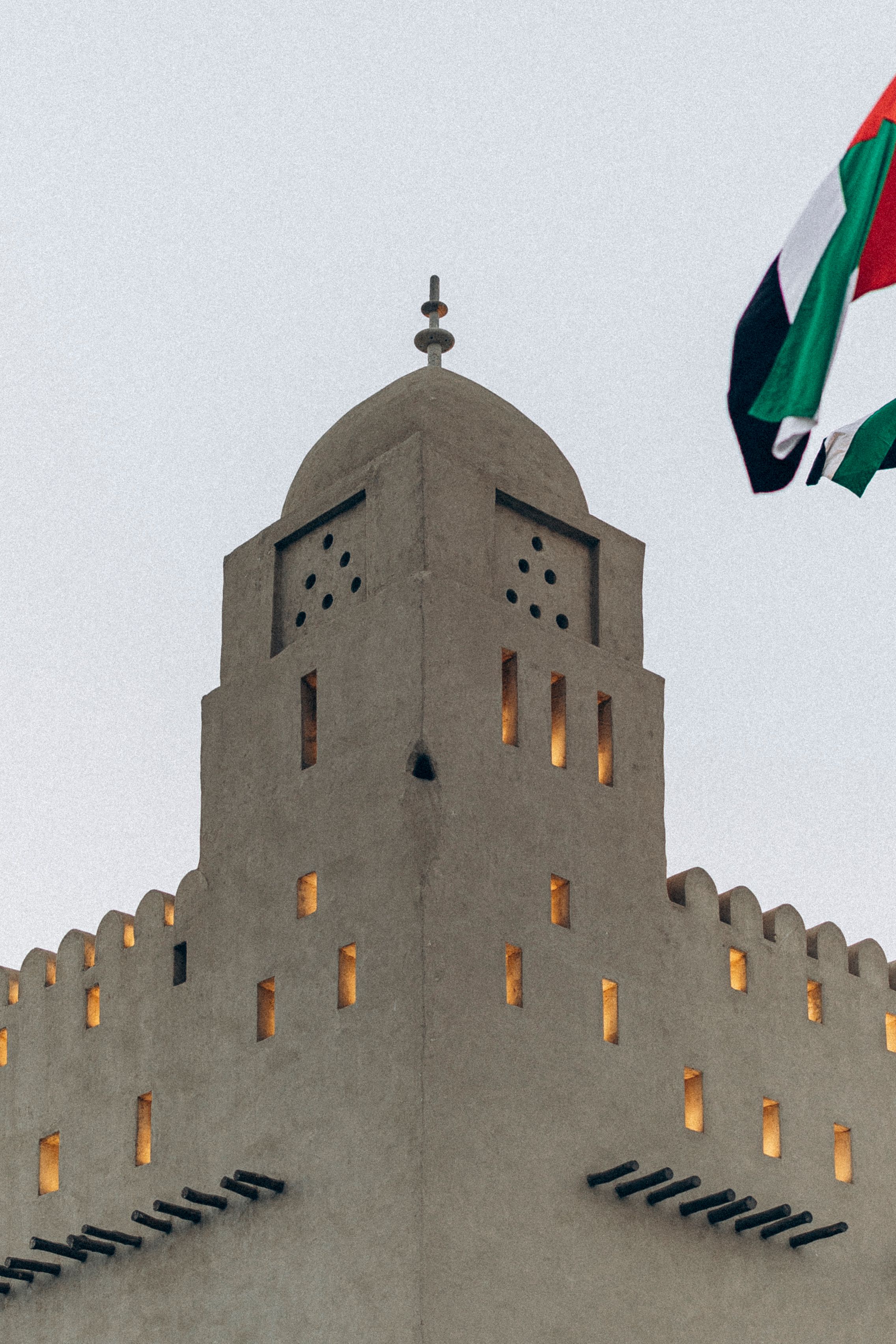 Historic Fort in Abu Dhabi with UAE Flag · Free Stock Photo