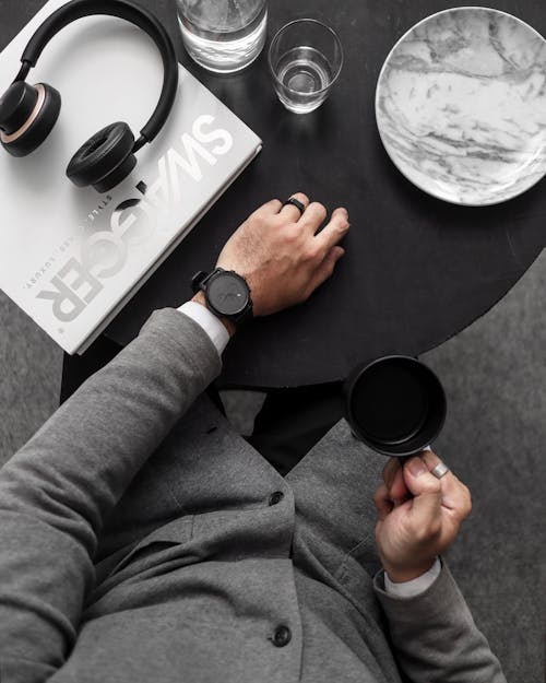 Free Man Holding Black Ceramic Mug Stock Photo