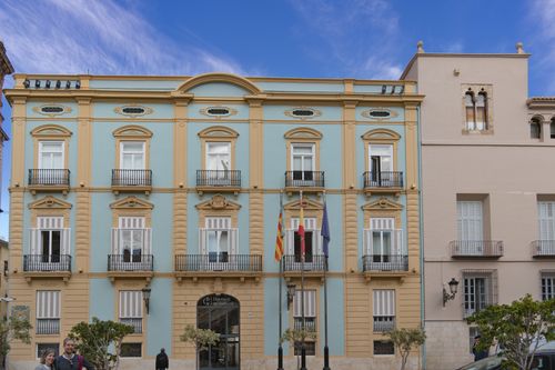 Free Beautiful neoclassical building in Valencia, Spain with blue sky backdrop. Stock Photo