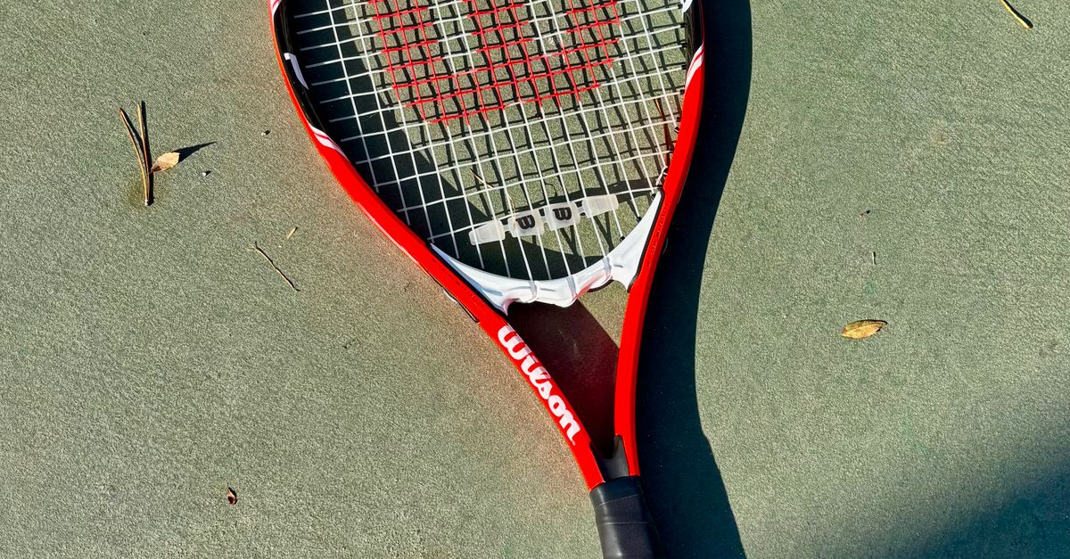 Red Tenis Racket Red Tennis Racket on Outdoor Court in Autumn · Free Stock Photo