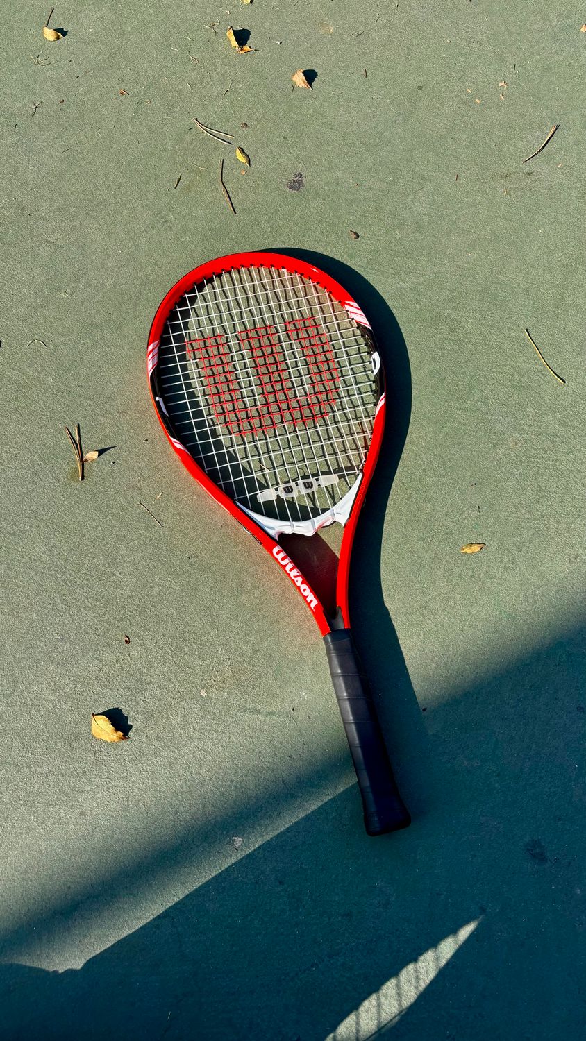 Red Tennis Racket on Outdoor Court in Autumn · Free Stock Photo