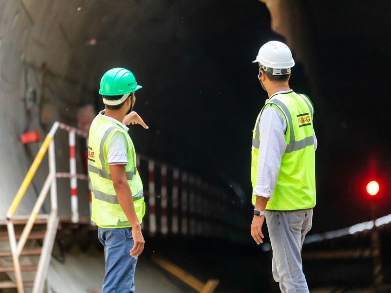 Construction workers inspecting an infrastructure project