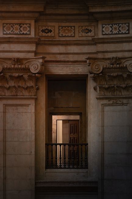 A beautifully detailed architectural facade in Lisbon, Portugal showcasing traditional craftsmanship and elegance.