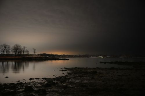 Free Peaceful twilight scene at Cove Island Park in Stamford, Connecticut, reflecting serene autumn colors. Stock Photo