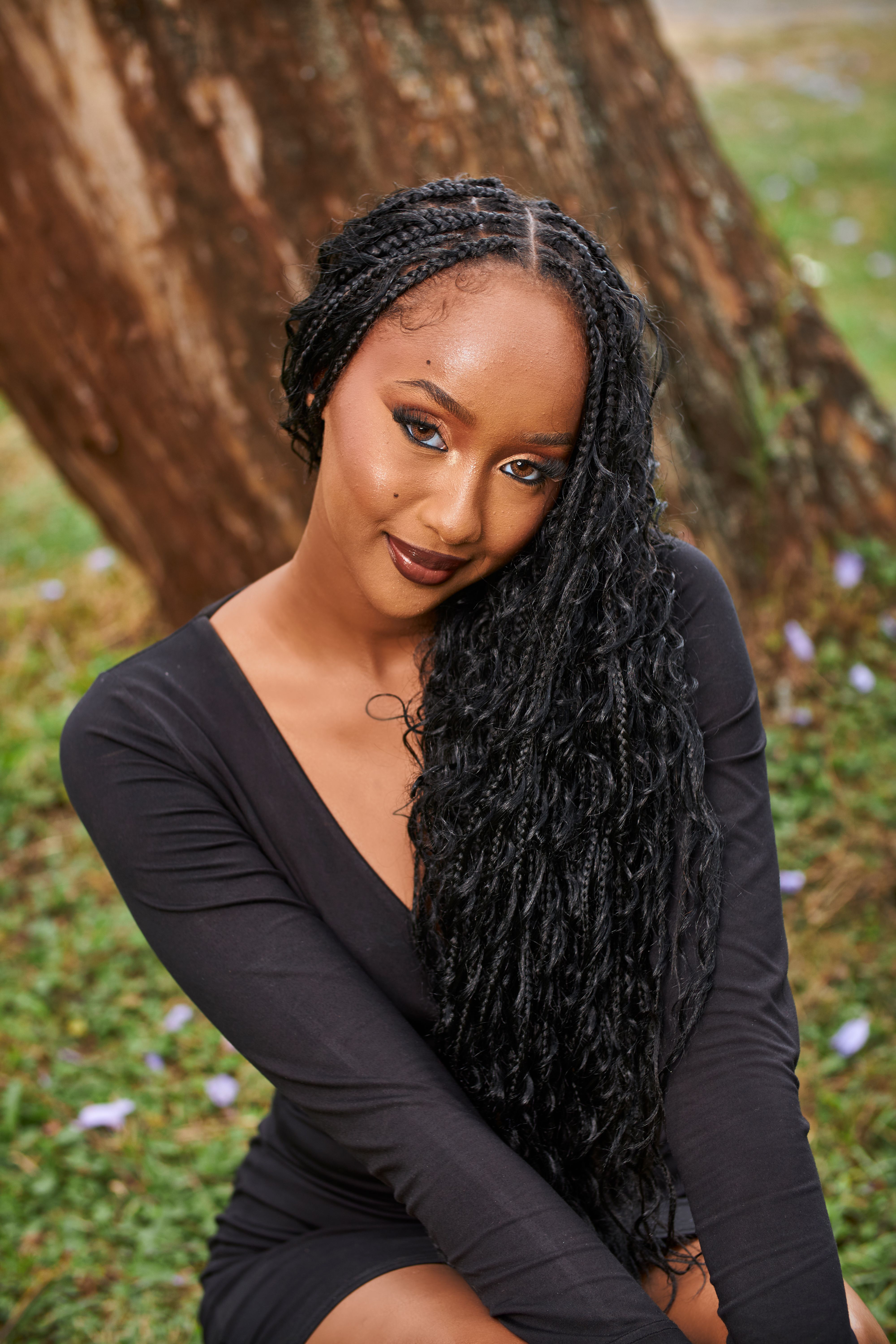 Portrait of a Woman with Braided Hairstyle Outdoors · Free Stock Photo