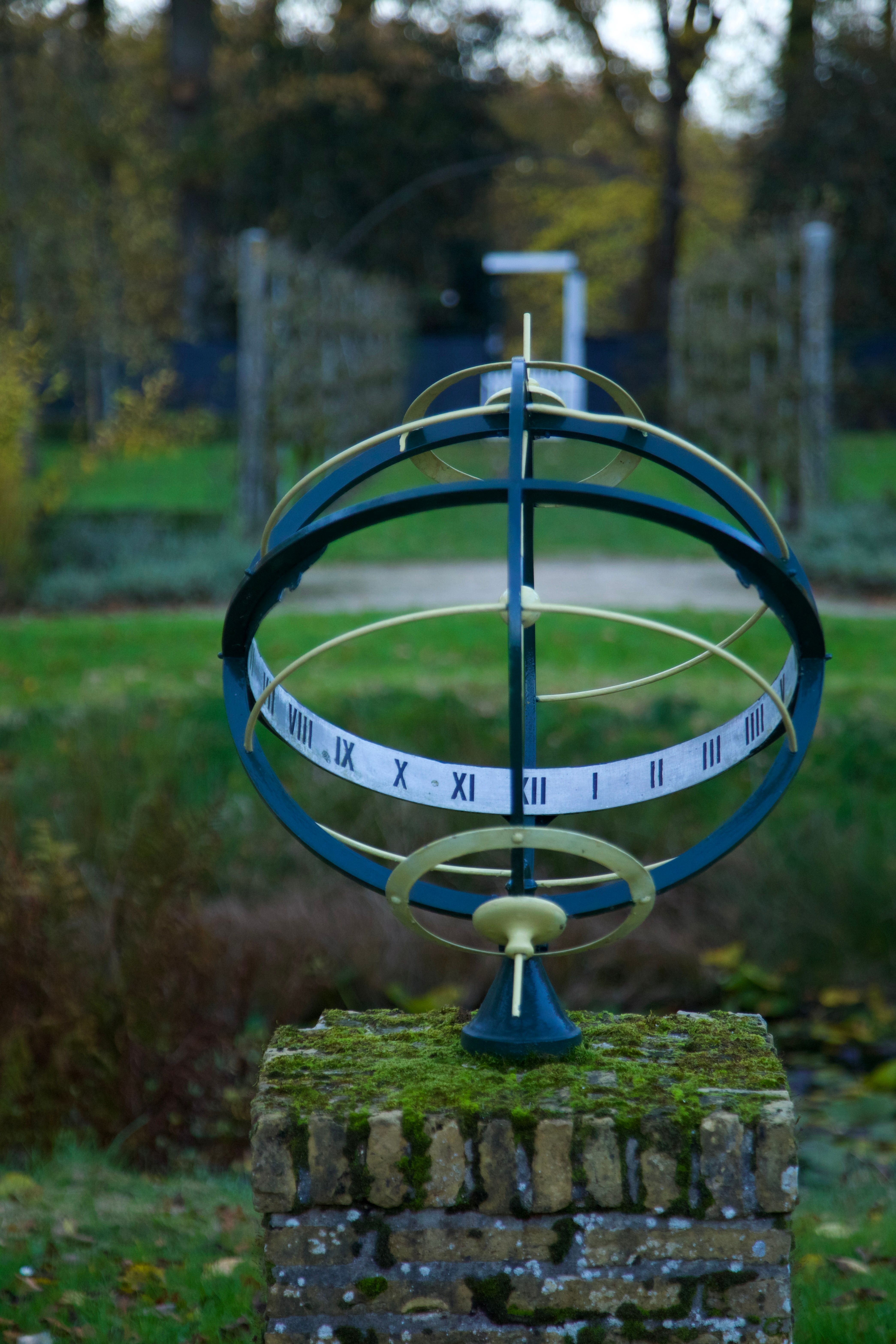 Outdoor Sundial in a Scenic Garden Setting · Free Stock Photo