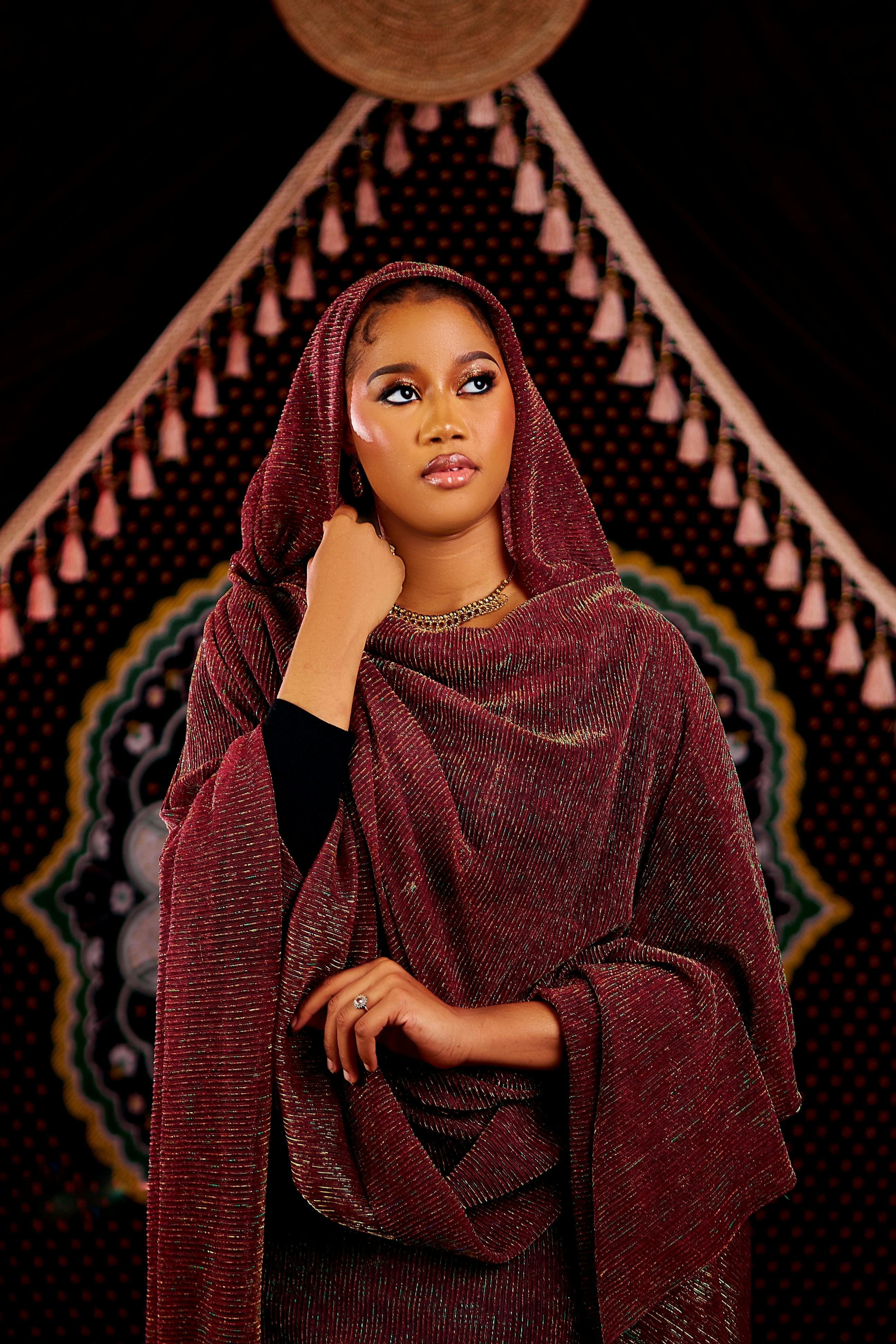 A graceful portrait of a woman in ornate traditional clothing, exuding elegance and cultural richness.