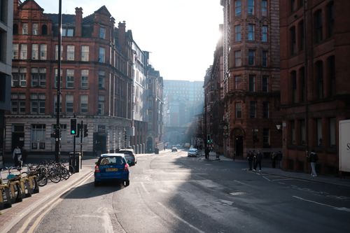 Free Iconic city street scene with classic architecture and vibrant daylight atmosphere. Stock Photo