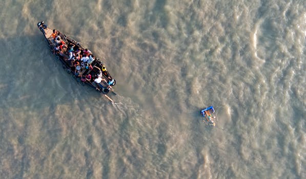 Aerial photo of a crowded boat on a river in Bangladesh, near Chattogram.