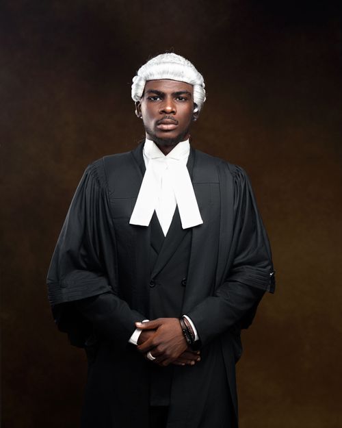 Free Portrait of a barrister wearing traditional court attire with a serene expression. Stock Photo