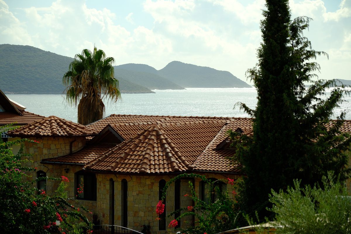 Mediterranean hillside villa with sea and mountain views