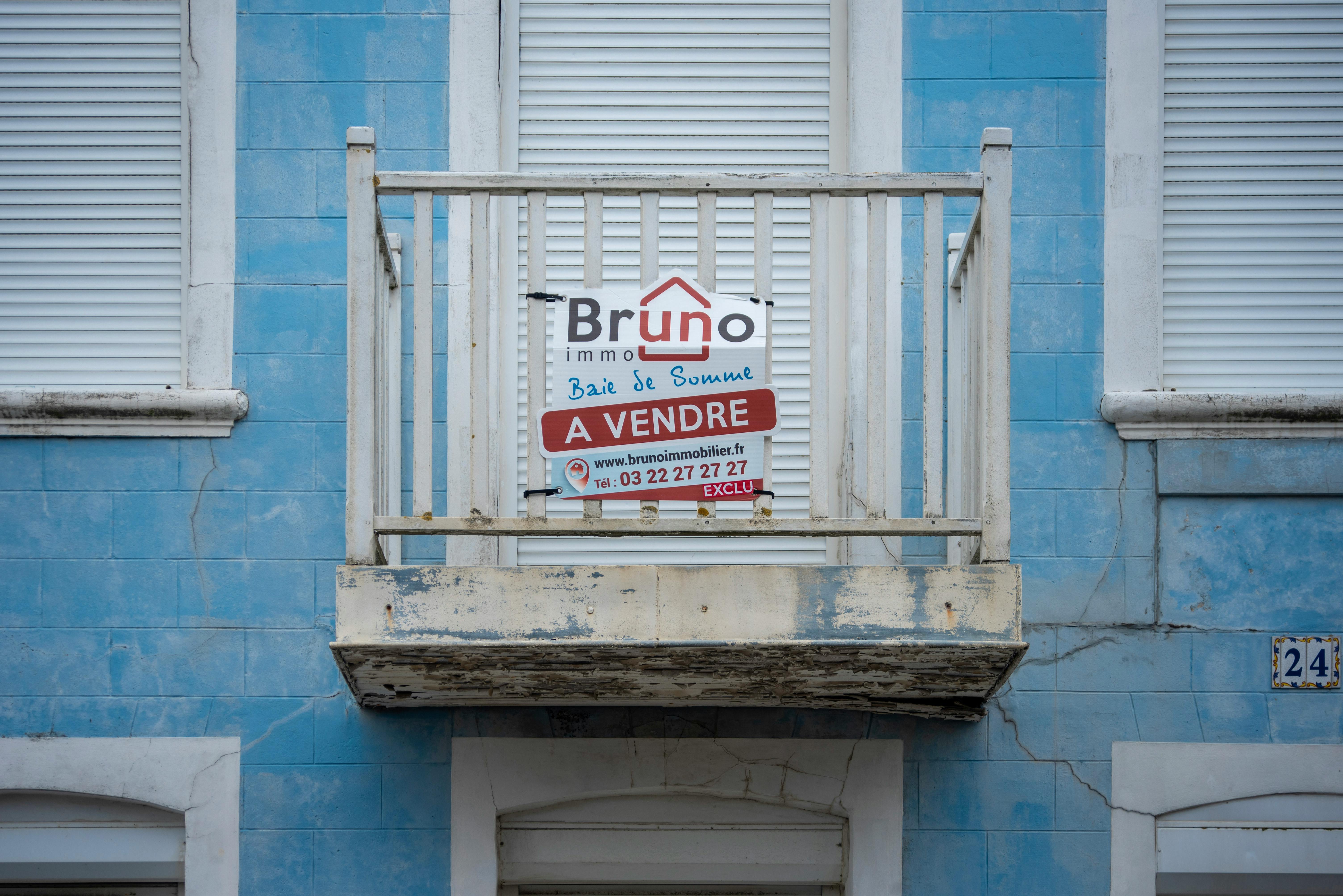 A worn blue facade with a