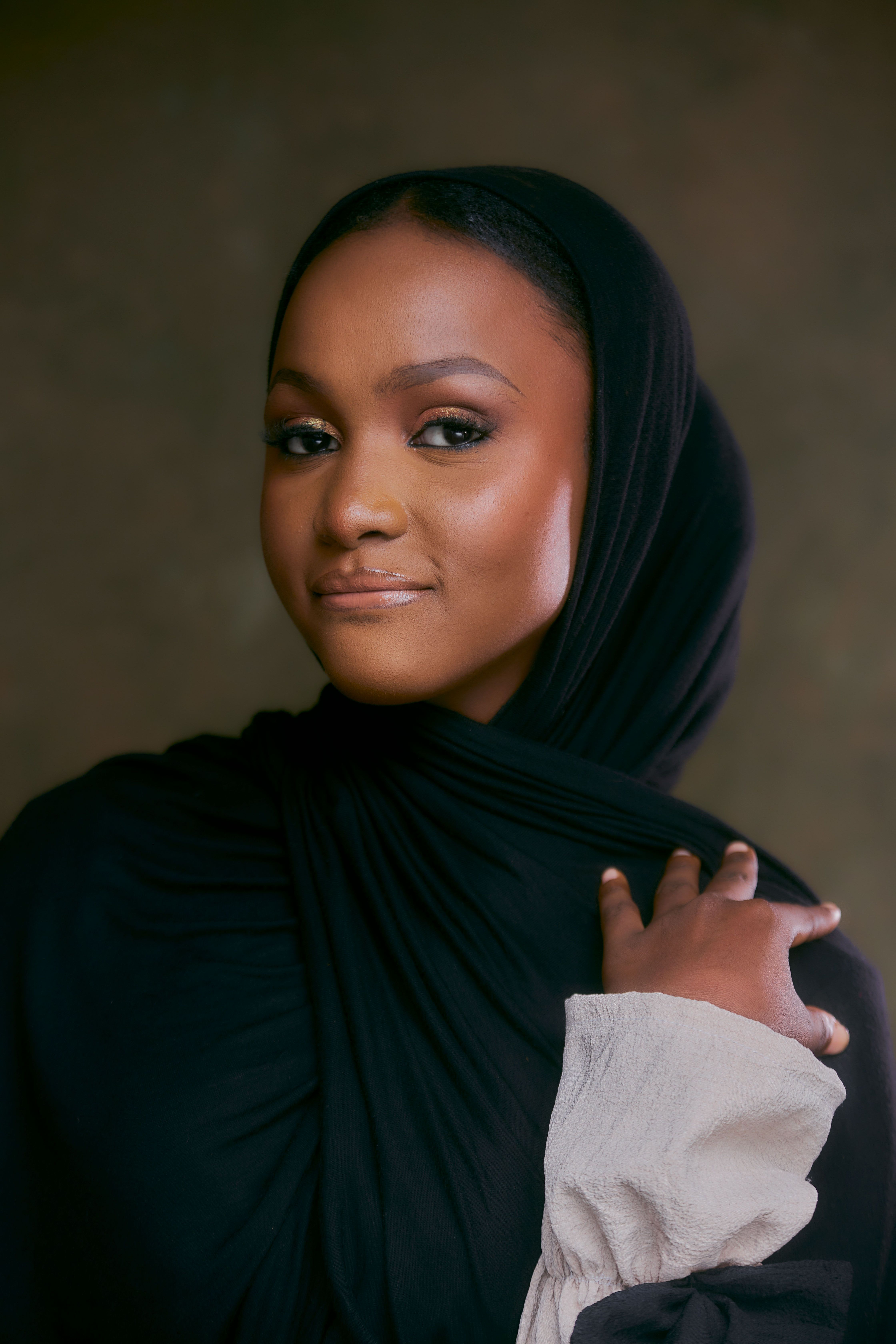 Woman with Hijab Posing Against Brown Background · Free Stock Photo